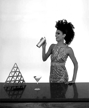 Woman with a martini shaker in Washington DC apartment, Origin. Concept by Gold Dog Communications.